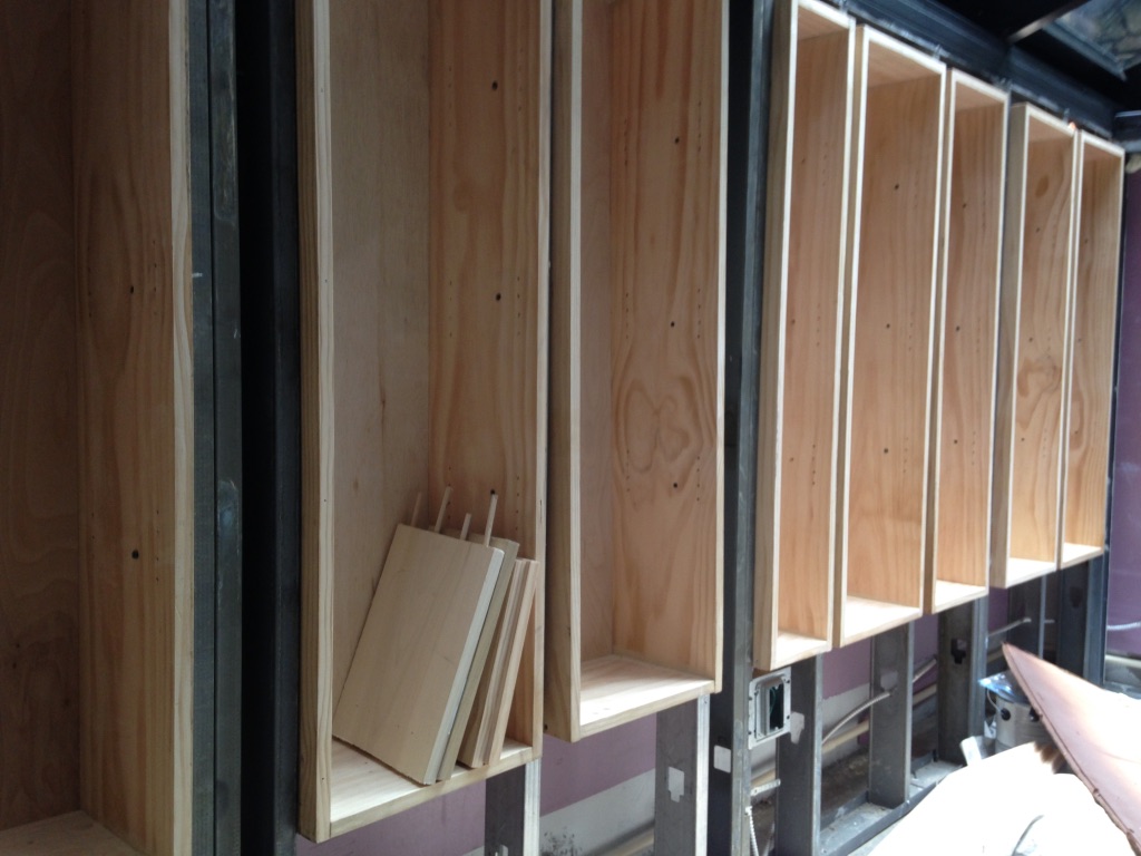 Custom shelving installed within the four-season sunroom walls before wall finishing.